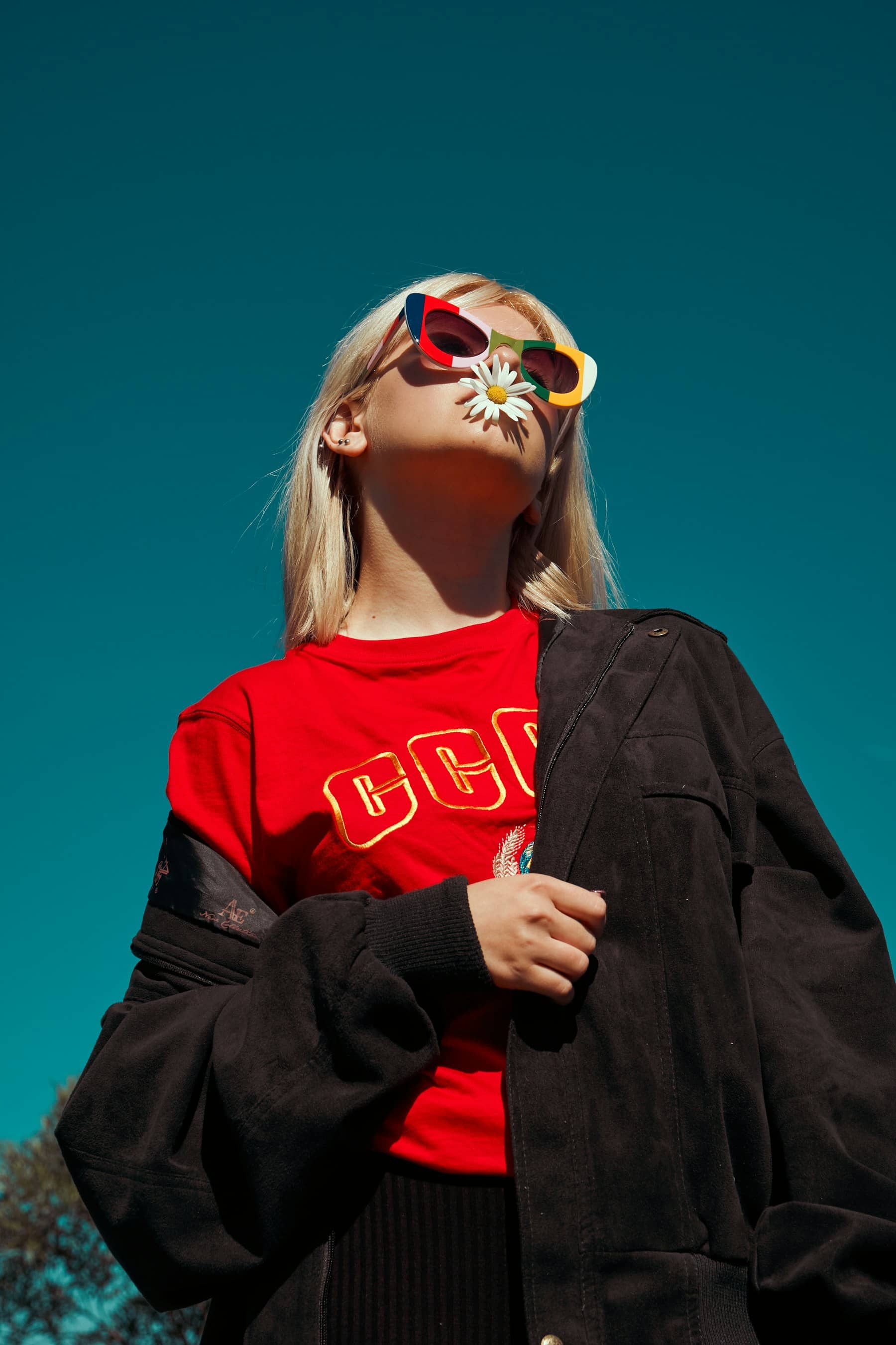 Streetwear model against a teal wall